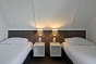 Schlafzimmer des behindertengerechtes Ferienhauses für 8 Personen in Nieuwvliet Bad und Holland